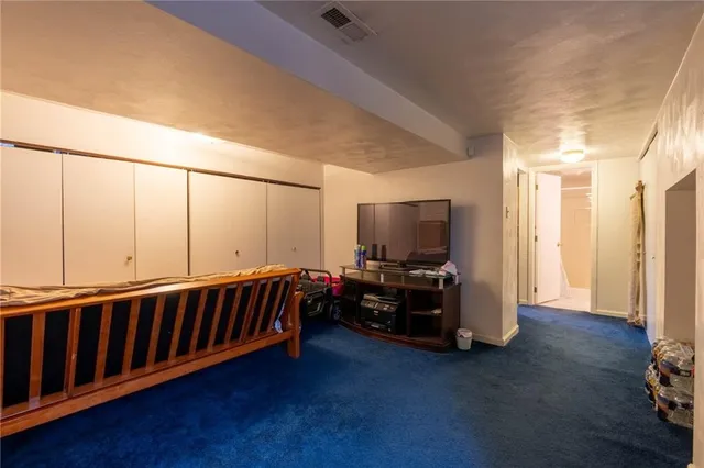 a view of living room with furniture and a flat screen tv