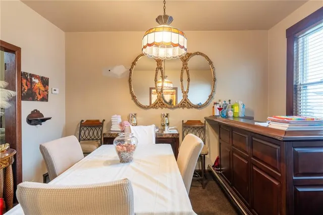 a living room with furniture and a mirror