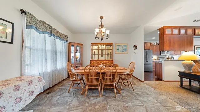 a view of a dining room with furniture window and outside view