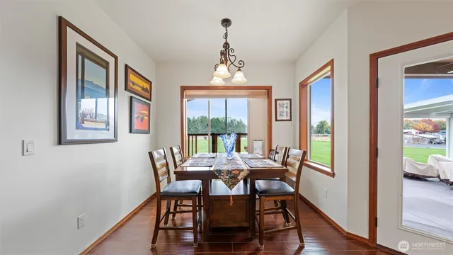 a view of a dining room with furniture window and wooden floor