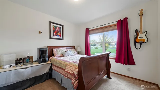 a bed room with a bed and window