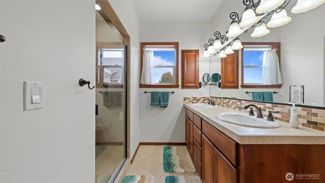 a bathroom with a sink a vanity and a mirror
