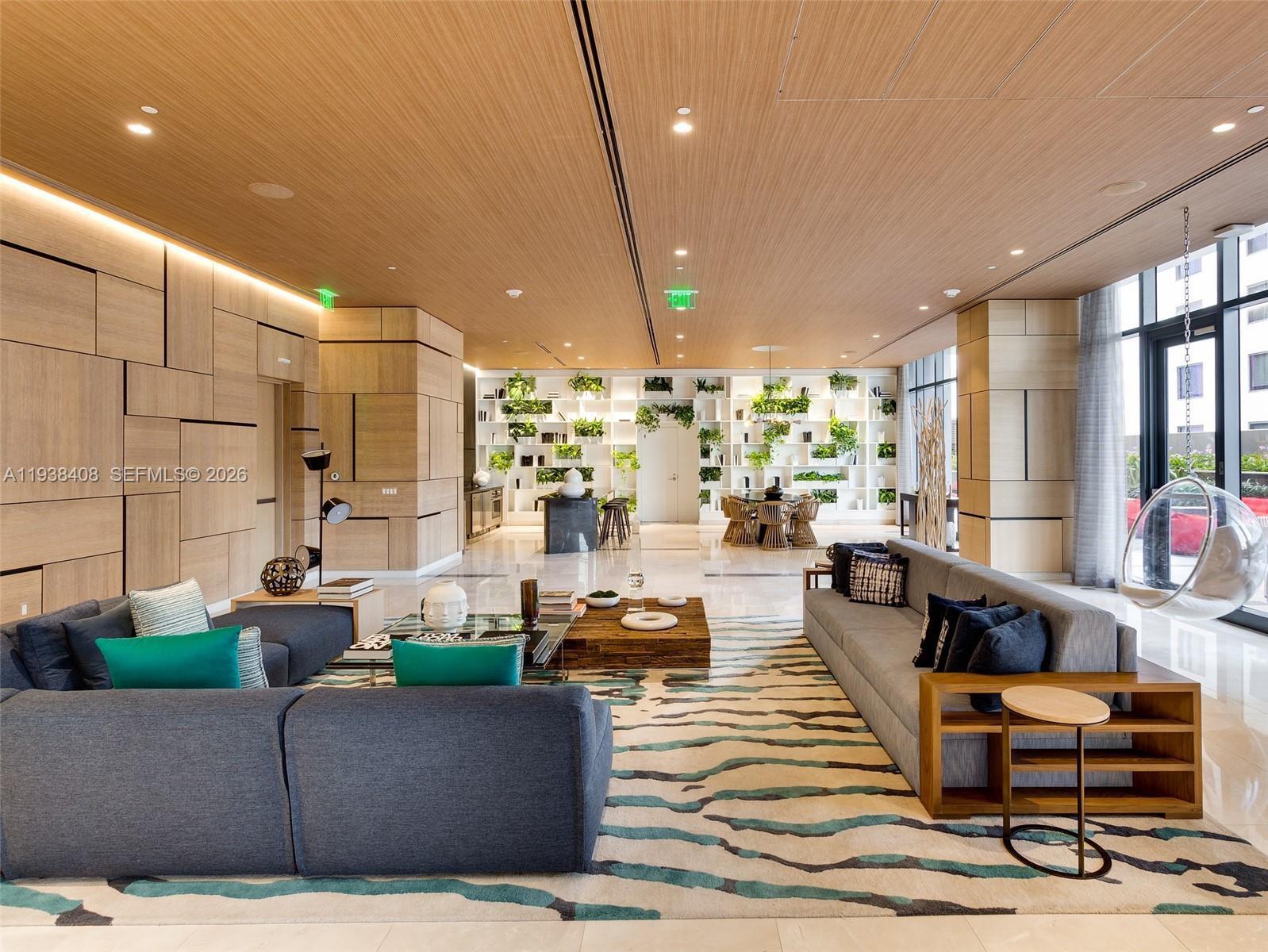 55 Southwest 9th Street, Unit 1808 Miami, FL 33130 - Photo 16 of 33 a living room with furniture and a large window