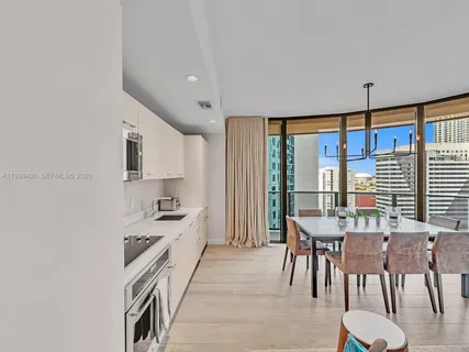 a kitchen with stainless steel appliances granite countertop a stove and a refrigerator