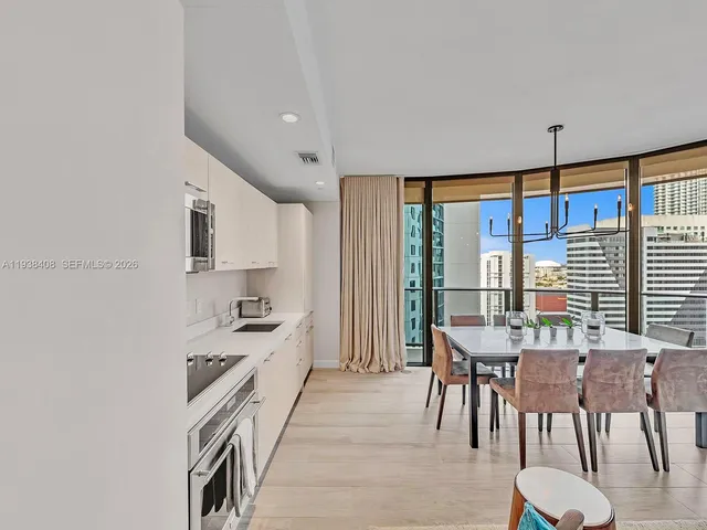 a kitchen with stainless steel appliances granite countertop a stove and a refrigerator