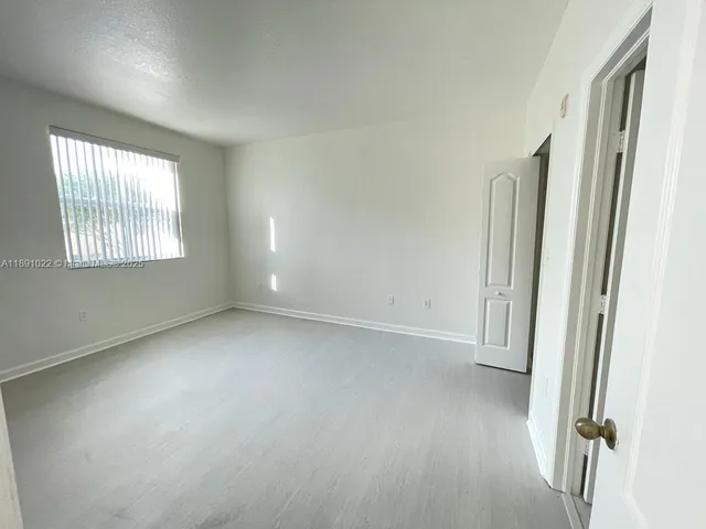 a bathroom with a toilet a sink and bathtub