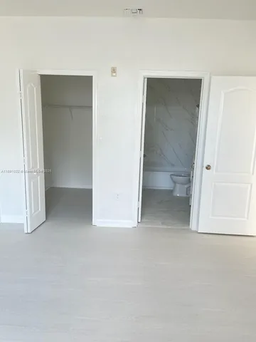 an empty room with mirror