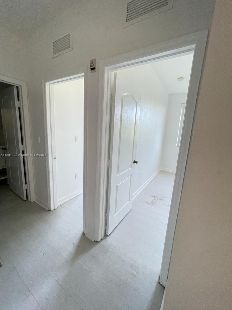 2903 Southeast 17th Avenue, Unit 206 Homestead, FL 33035 - Photo 16 of 28 an empty room with mirror