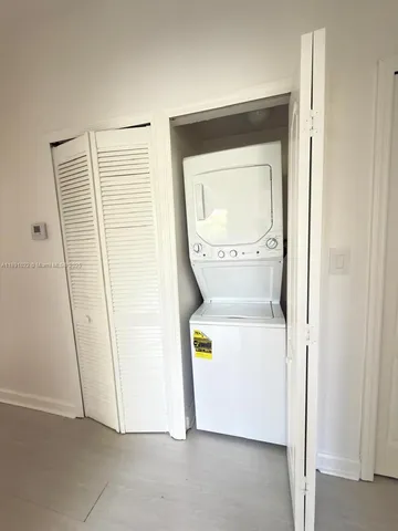 a view of a chairs and table in patio