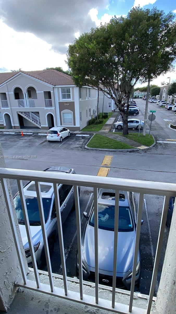 2903 Southeast 17th Avenue, Unit 206 Homestead, FL 33035 - Photo 26 of 28 a view of a chairs and table in patio