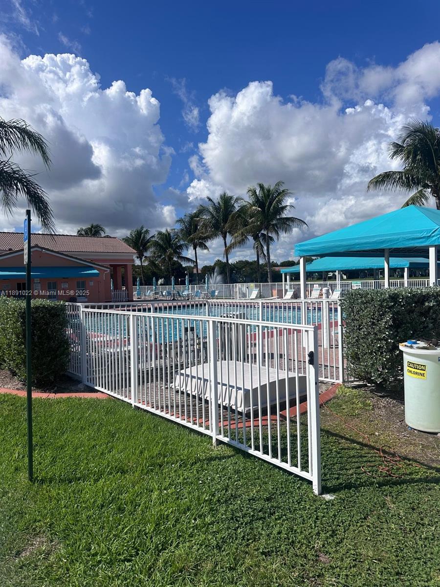 2903 Southeast 17th Avenue, Unit 206 Homestead, FL 33035 - Photo 27 of 28 a view of a house with backyard and porch