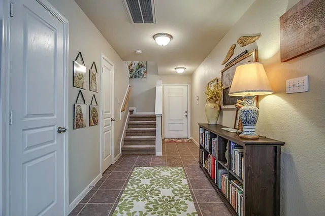 a view of an entryway with wooden floor