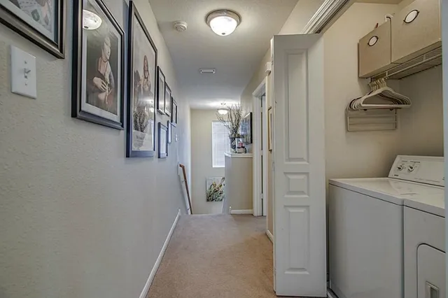 a view of a hallway with an entryway