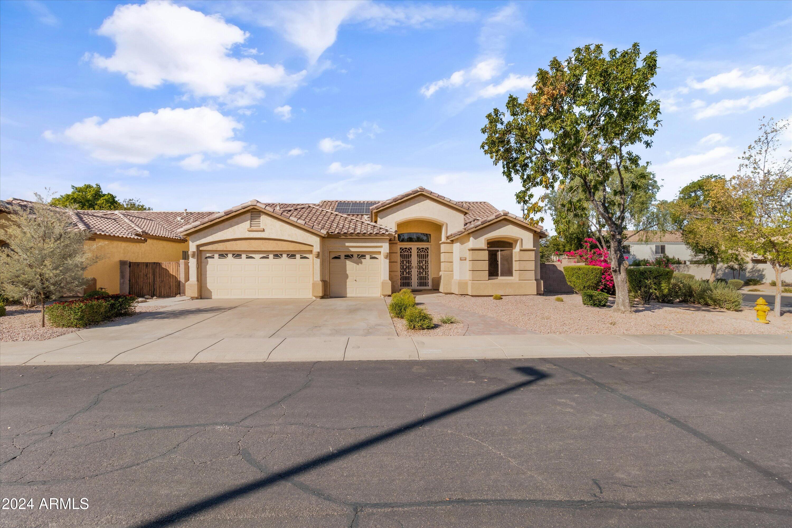 2860 East Nunneley Road Gilbert, AZ 85296 - Photo 1 of 28 a view of multiple houses with a street