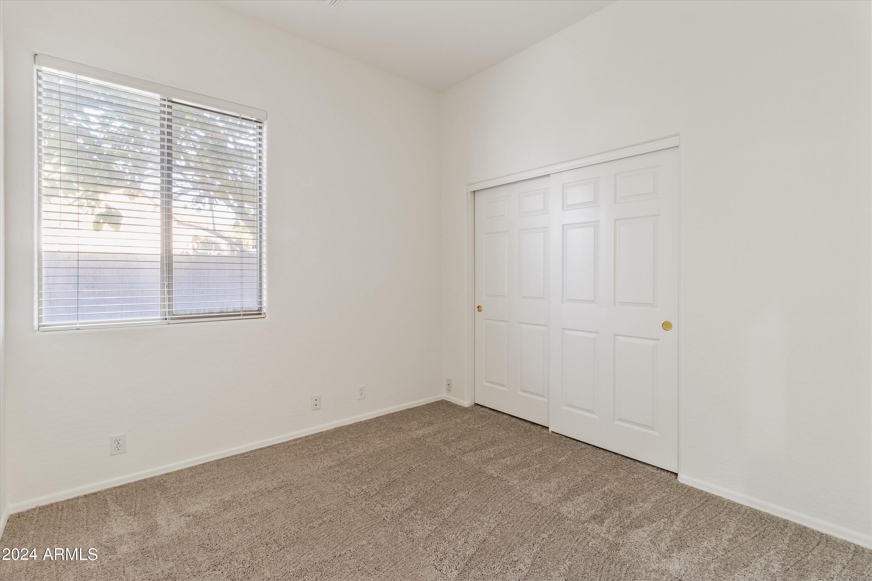 2860 East Nunneley Road Gilbert, AZ 85296 - Photo 15 of 28 a view of an empty room with a window