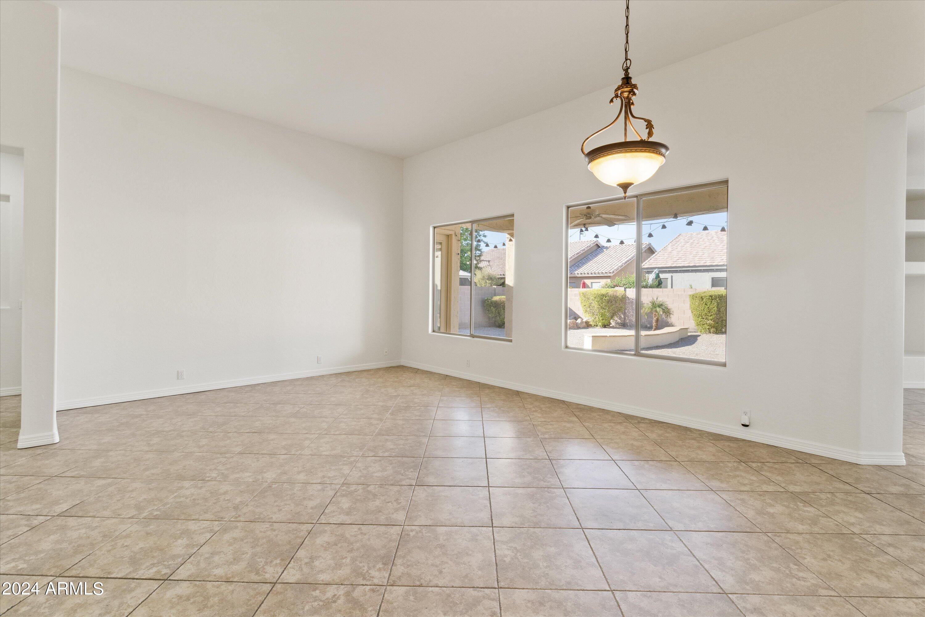 2860 East Nunneley Road Gilbert, AZ 85296 - Photo 9 of 28 a view of an empty room with a window