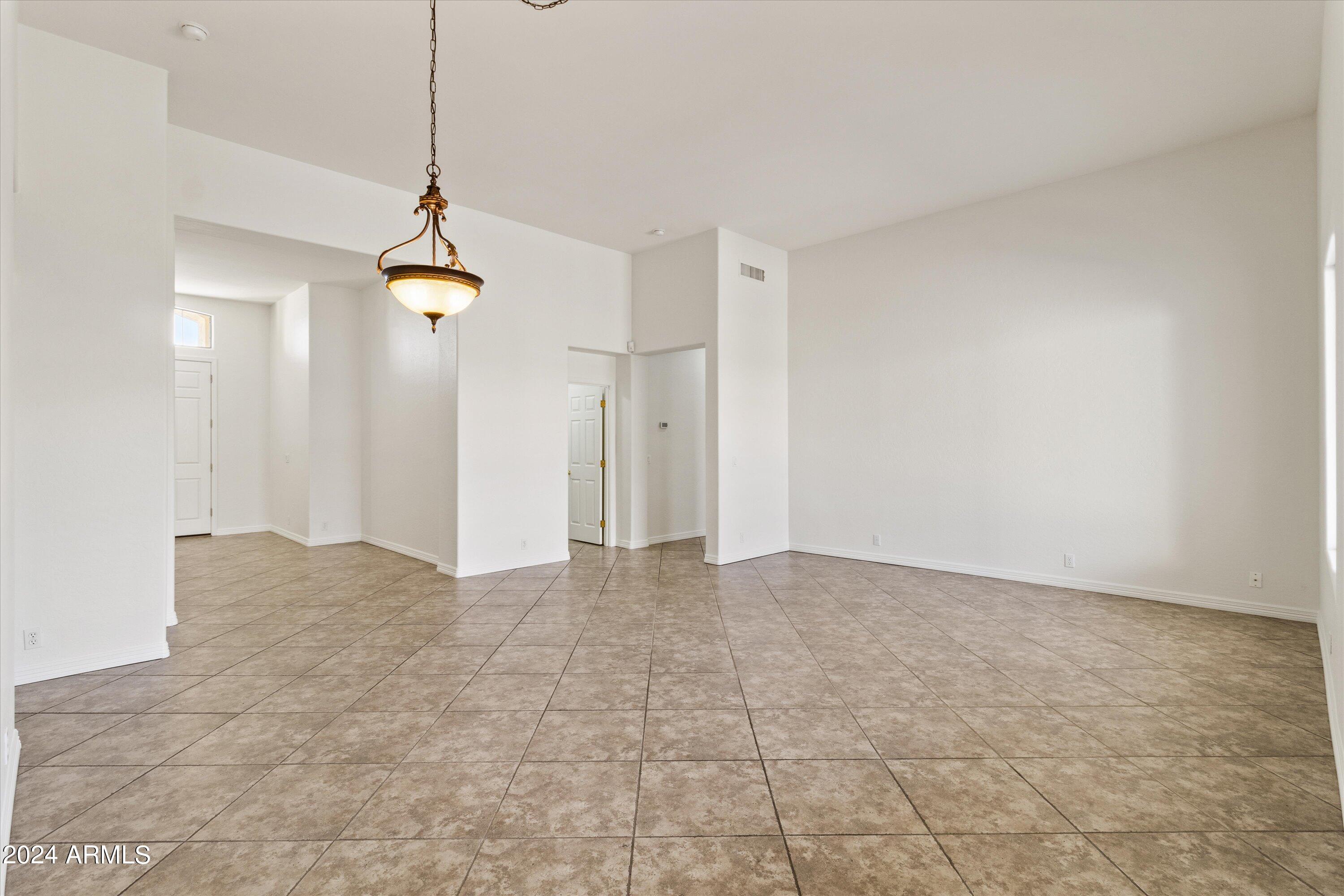 2860 East Nunneley Road Gilbert, AZ 85296 - Photo 10 of 28 a view of an empty room and a chandelier fan