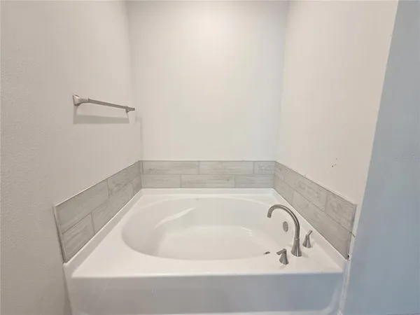 a white bath tub sitting in a bathroom