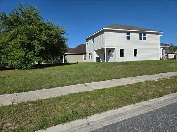 a view of a back yard of the house