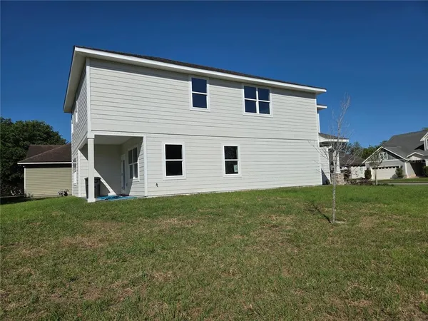 a view of front of house with a yard