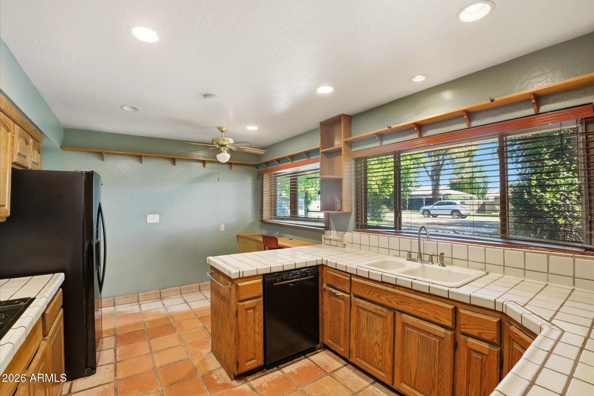 8324 North 8th Avenue Phoenix, AZ 85021 - Photo 10 of 39 a kitchen with a sink and large window