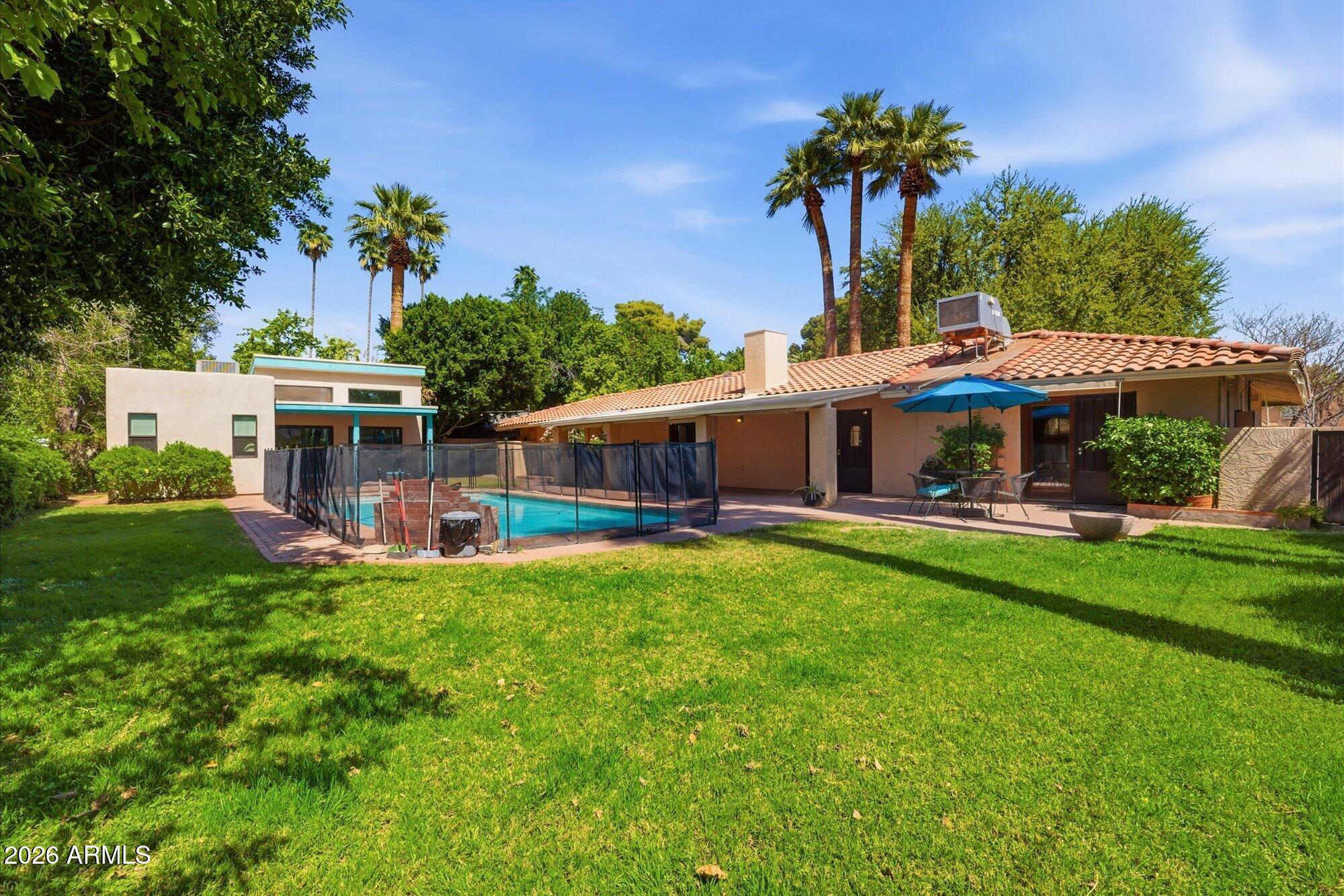 8324 North 8th Avenue Phoenix, AZ 85021 - Photo 27 of 39 a front view of a house with a garden and porch