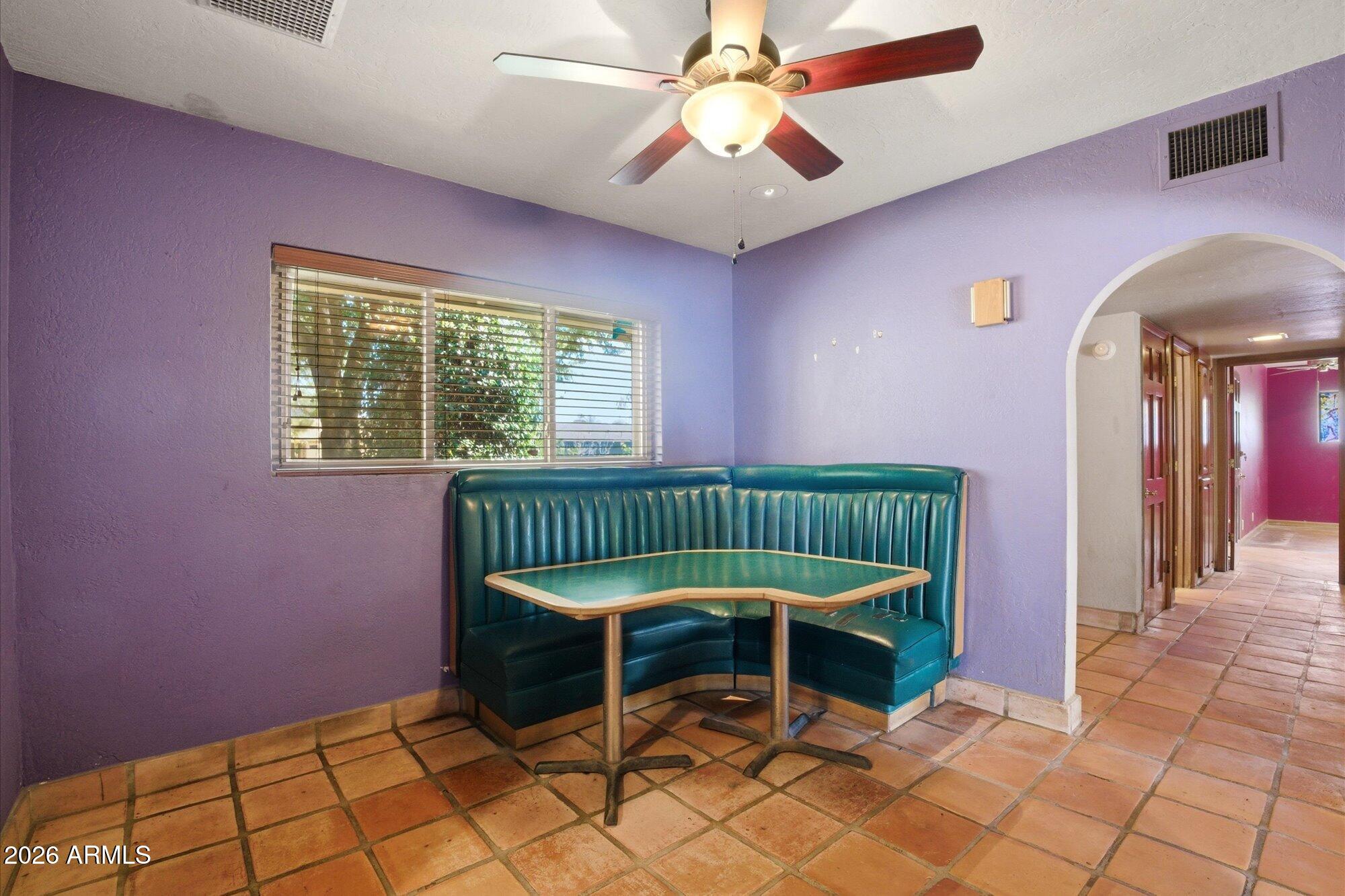 8324 North 8th Avenue Phoenix, AZ 85021 - Photo 7 of 39 a chair and a table in a room
