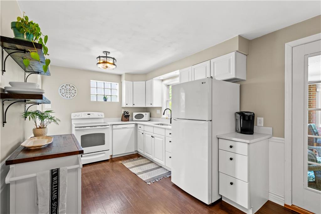 1376 Morrow Road Pittsburgh, PA 15241 - Photo 6 of 25 a kitchen with white cabinets and white appliances
