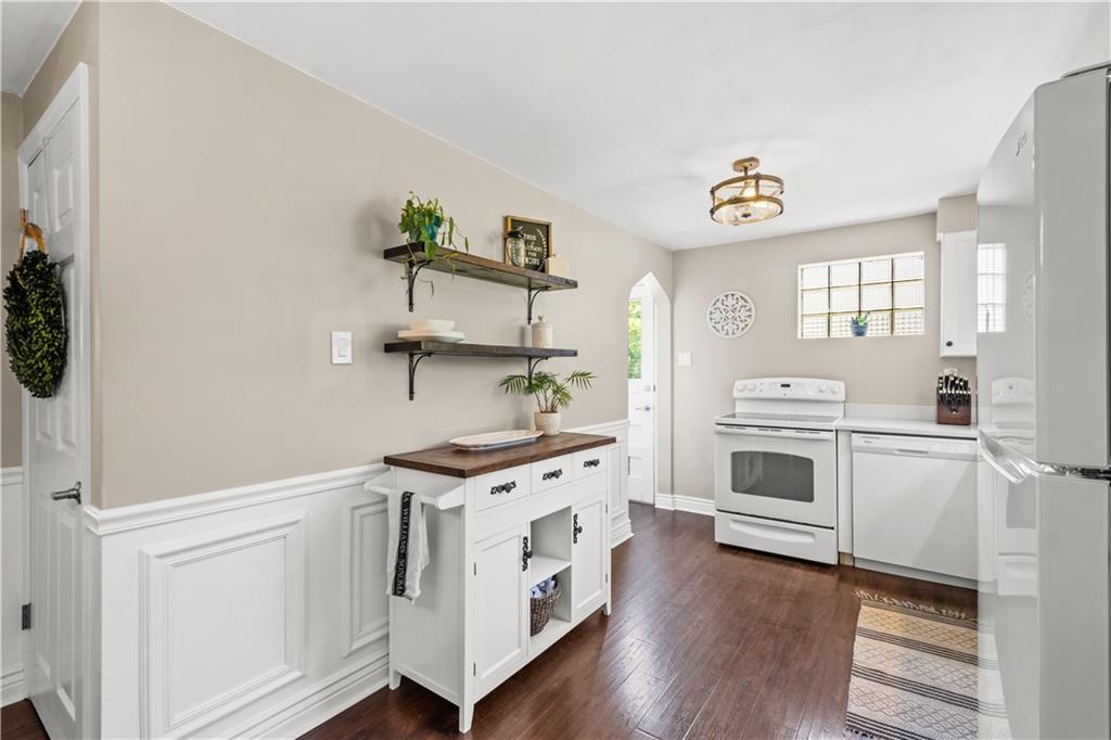 1376 Morrow Road Pittsburgh, PA 15241 - Photo 7 of 25 a kitchen with white cabinets and white appliances