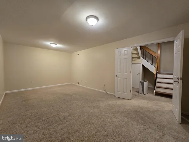 a view of an empty room and closet