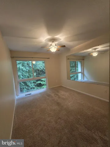 a bathroom with a granite countertop toilet a sink and bathtub