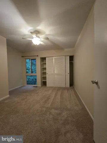 a view of hallway with wooden floor