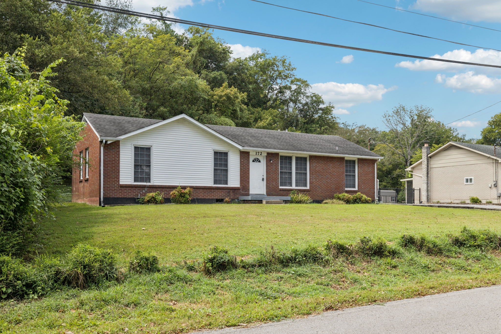 172 Mayhew Road Clarksville, TN 37040 - Photo 3 of 30 a view of a yard in front of a house with plants
