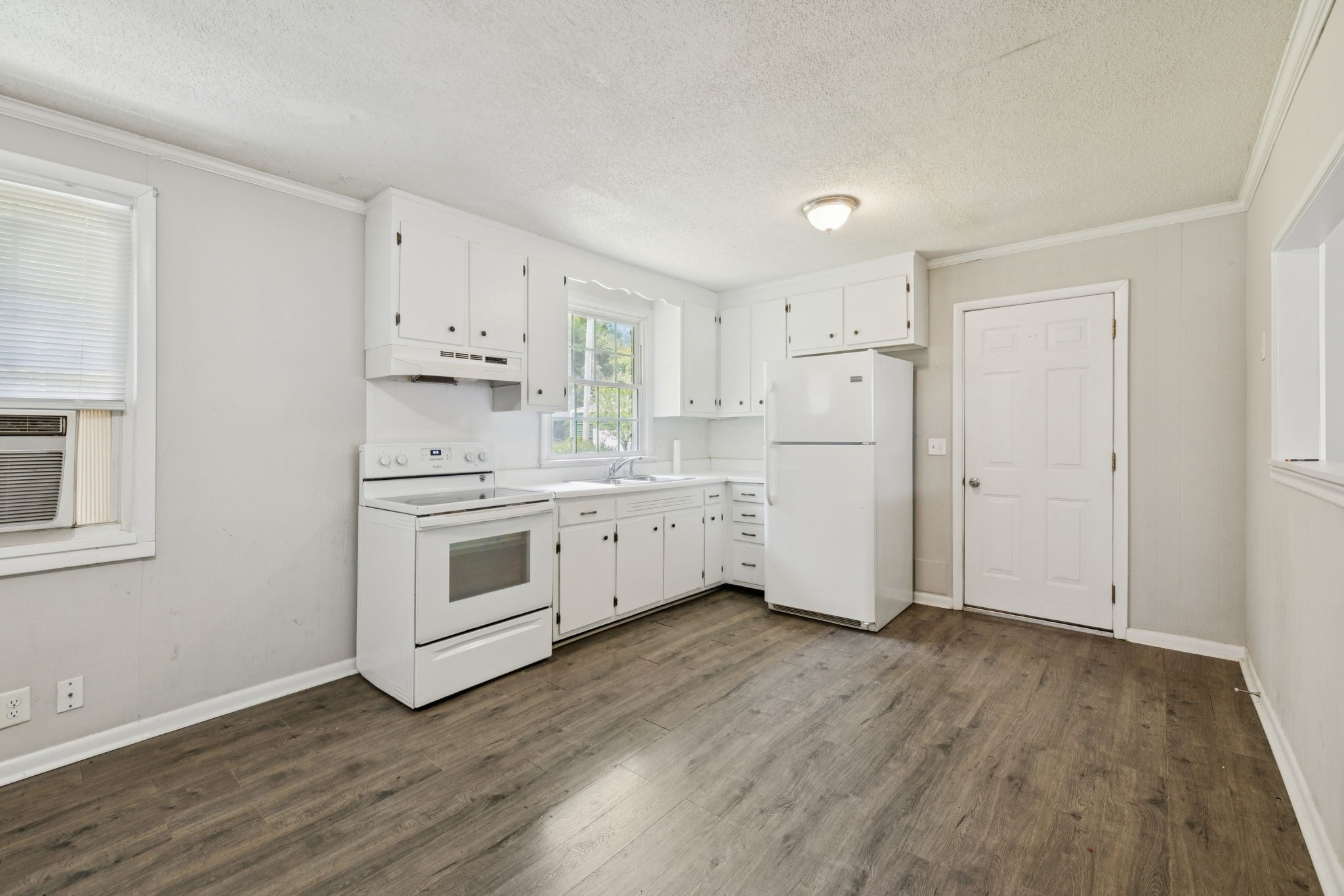 172 Mayhew Road Clarksville, TN 37040 - Photo 8 of 30 a kitchen with white cabinets white stainless steel appliances and sink