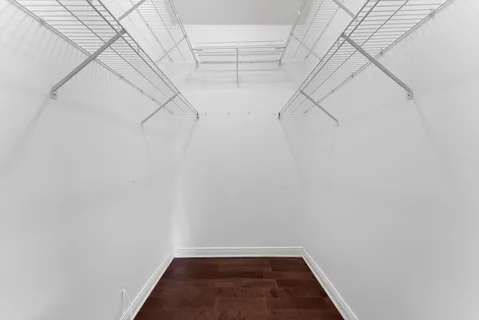 a bathroom with a toilet a sink and a window