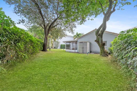 a view of a backyard of the house