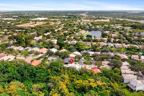 an aerial view of a house with outdoor space