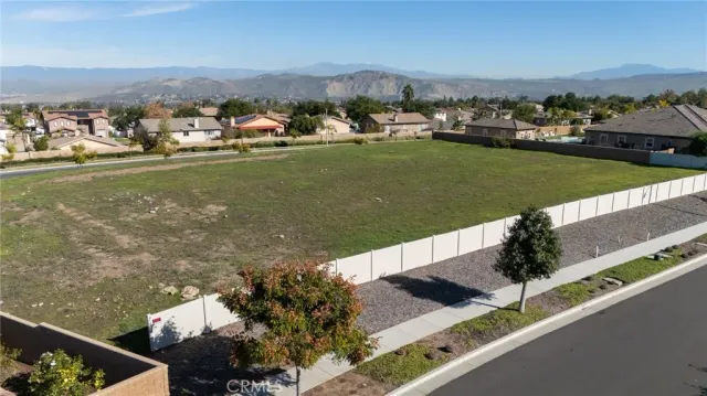 an aerial view of a houses with a lake view