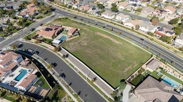 an aerial view of a residential apartment building with a yard