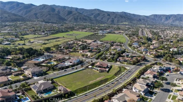 an aerial view of residential houses and outdoor space