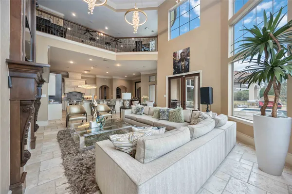 a open kitchen with stainless steel appliances kitchen island granite countertop a table and chairs in it