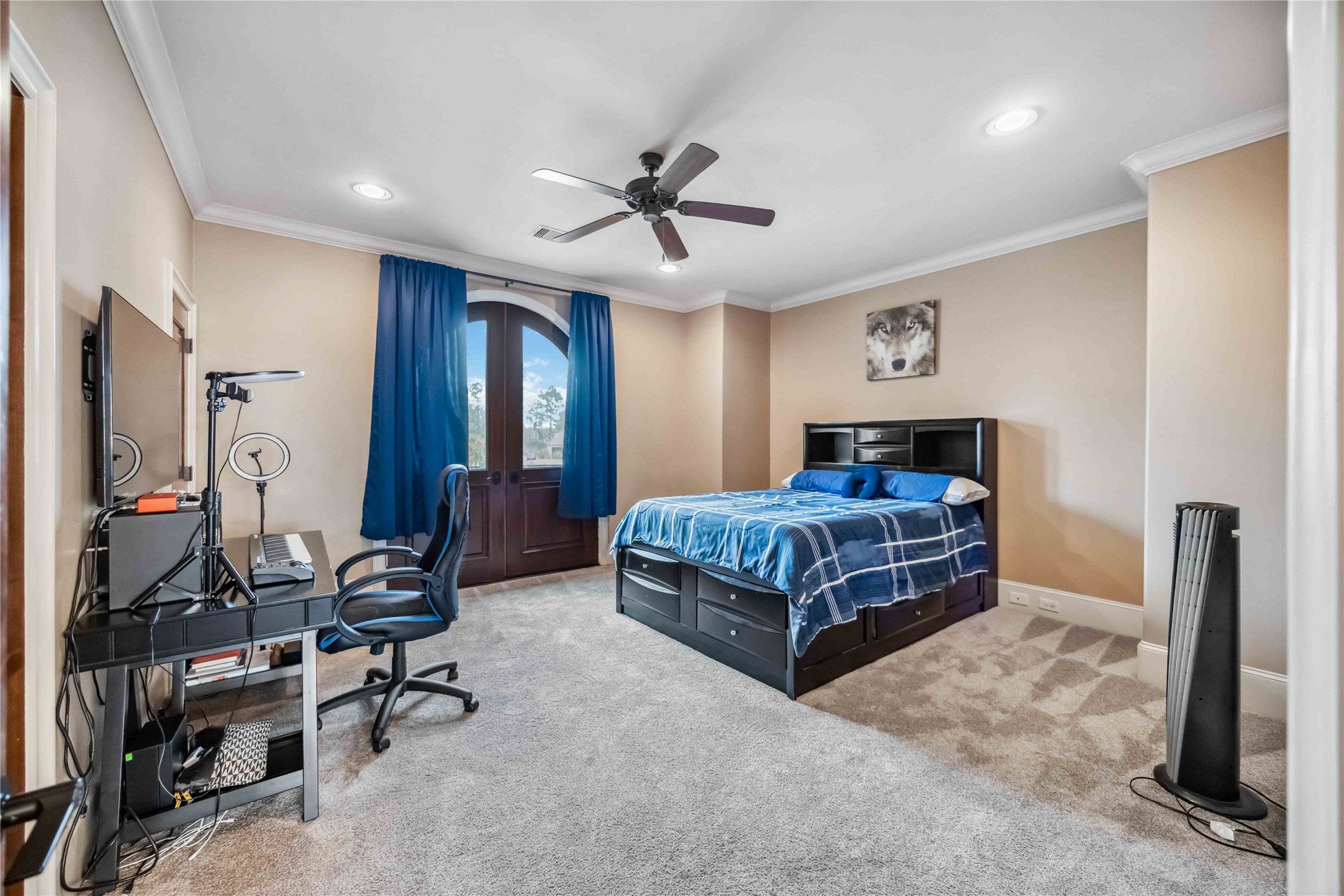 4510 Siandra Creek Court Spring, TX 77386 - Photo 35 of 50 a bedroom with a bed and a chandelier