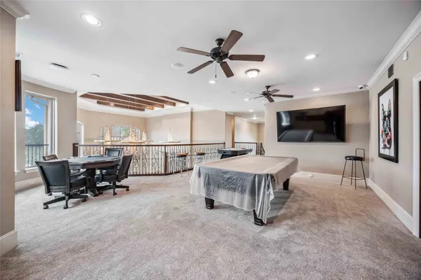 a living room with furniture a rug and a window