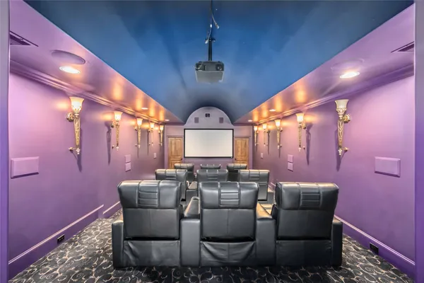 a bedroom with furniture and a chandelier