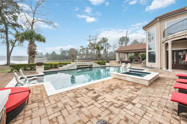 a view of swimming pool with outdoor seating
