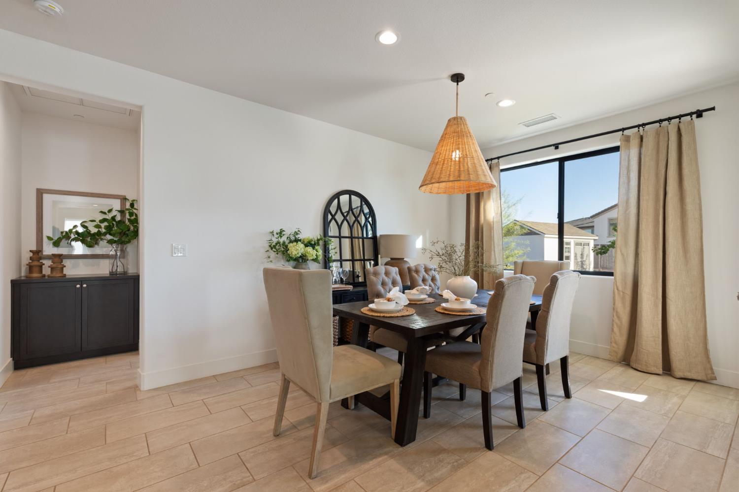 1022 Moonrise Way Madera, CA 93636 - Photo 17 of 52 a view of a dining room with furniture window and wooden floor