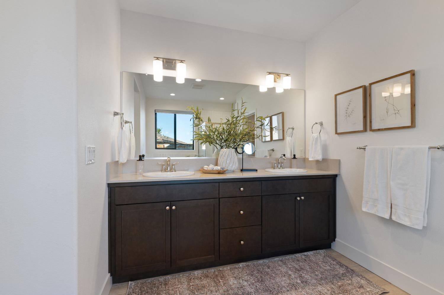 1022 Moonrise Way Madera, CA 93636 - Photo 20 of 52 a bathroom with a double vanity sink and a mirror