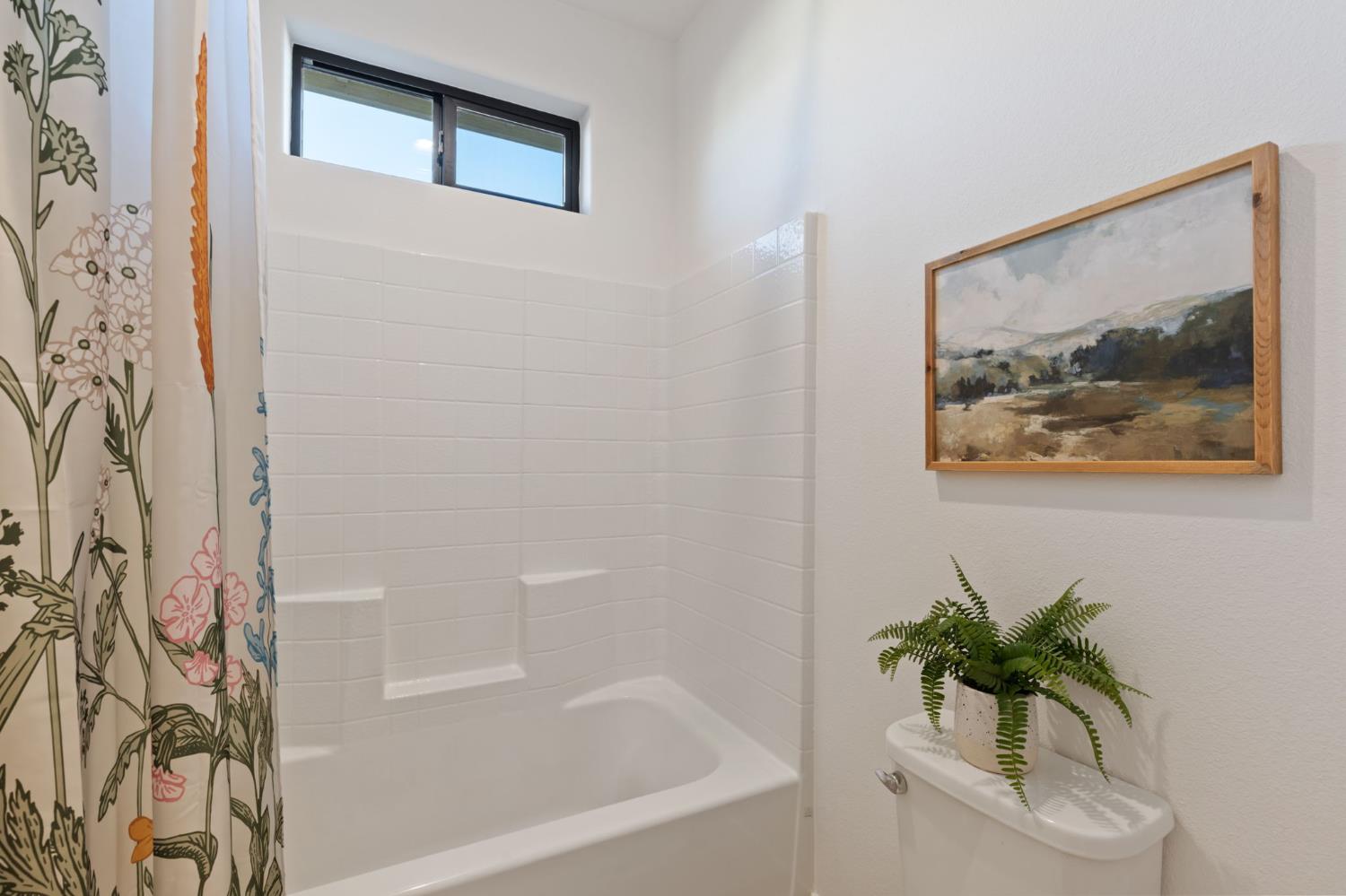 1022 Moonrise Way Madera, CA 93636 - Photo 28 of 52 a white bath tub with a shower