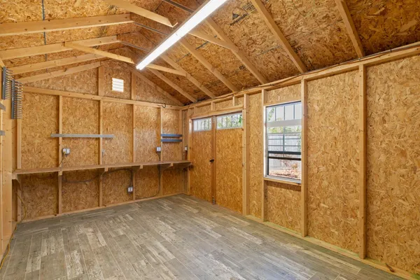 a view of a room with wooden walls