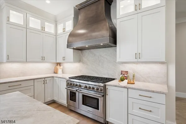 a kitchen with sink cabinets and wooden floor